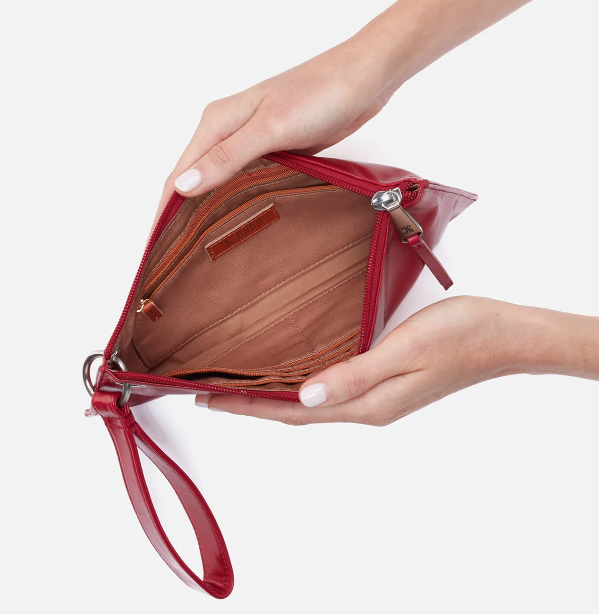 Vida Wristlet Crimson by HOBO features convenient wristlet strap, zipper closure, room for your phone and credit card slots. Shop at The Painted Cottage in Edgewater, MD.